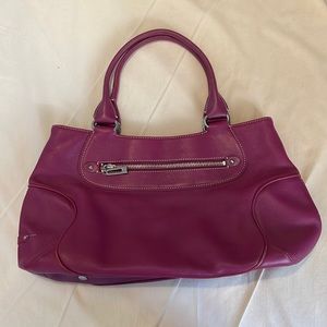 Cole Haan magenta handbag.